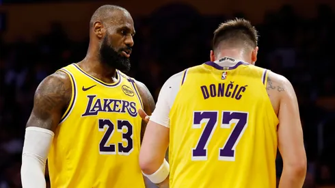 LeBron James #23 and Luka Doncic #77 of the Los Angeles Lakers react.