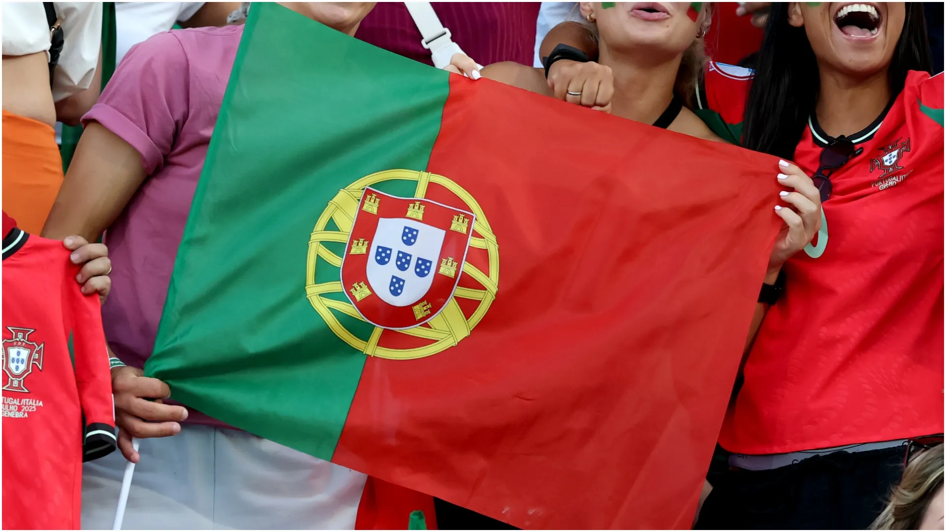 Fans of Portugal holds national flag – Alexander Hassenstein/Getty Images