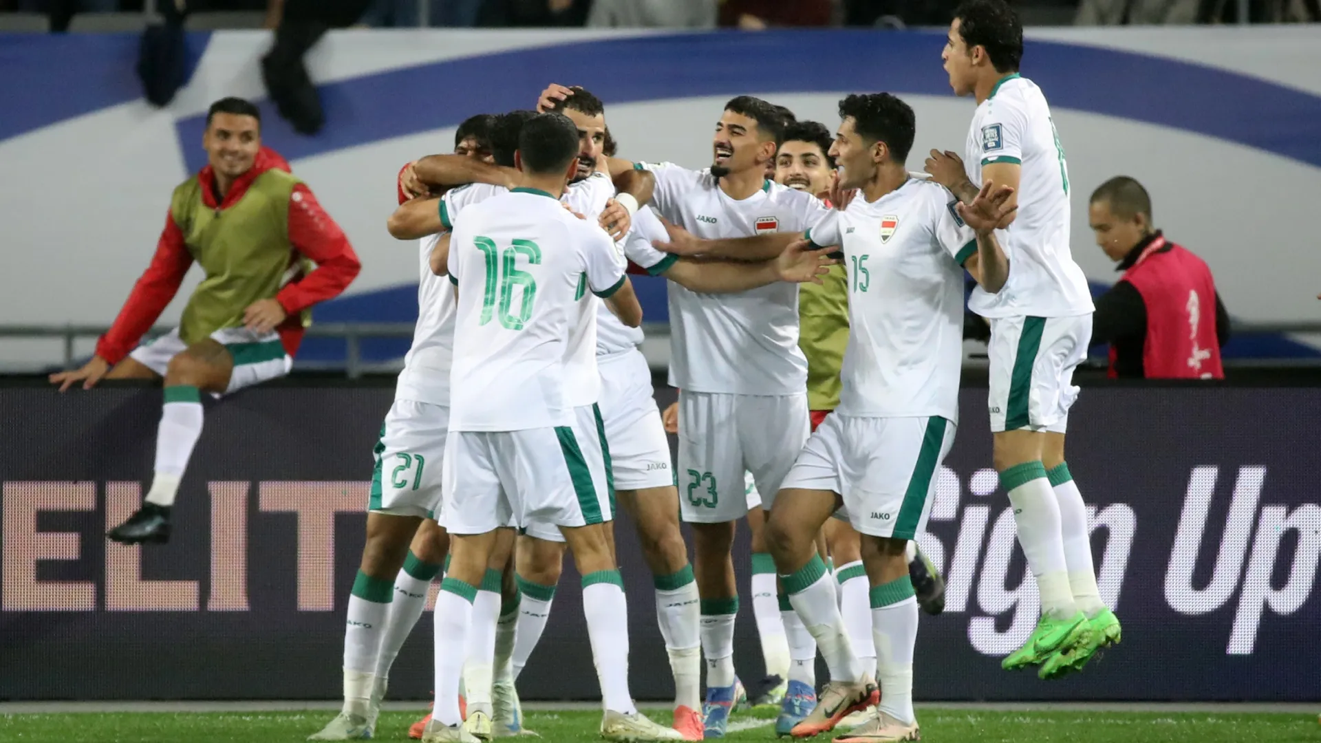 Aymen Hussein of Iraq (4th L) celebrates after scoring the team’s first goal. Chung Sung-Jun/Getty Images