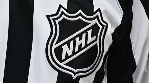 A closeup view of the NHL crest is seen on a referee jersey