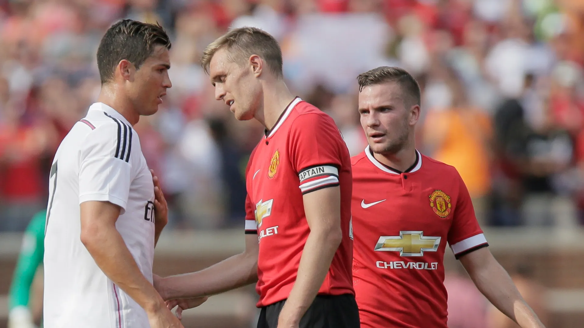 Cristiano Ronaldo #7 of Real Madrid talks with Darren Fletcher #24 and Tom Cleverley #23 of Manchester United.